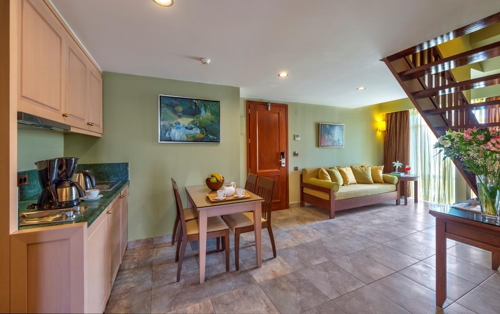 Porto Platanias Maisonette with Garden or Pool View interior image of the kitchen and living room